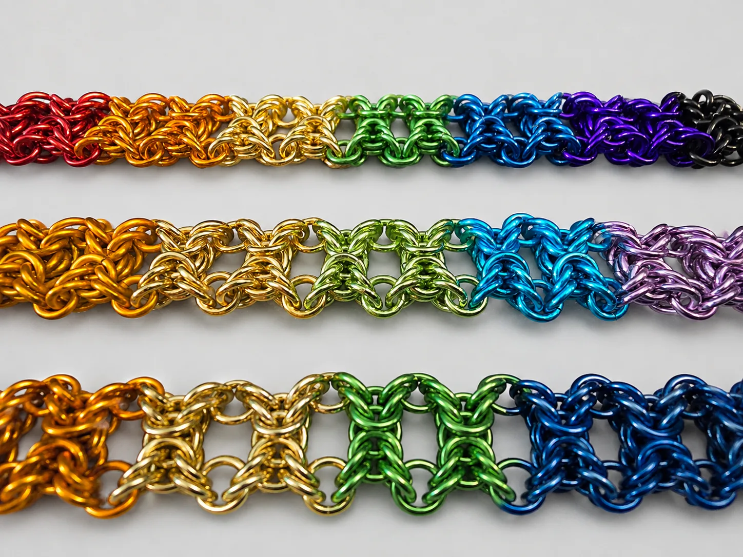 Olivia bracelets shown in three rainbow color layouts