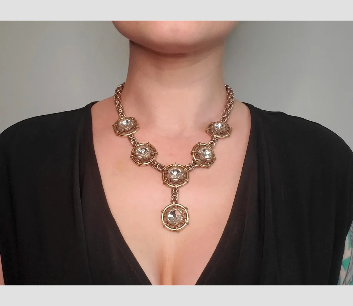KrakenMaille scale necklace worn by a model