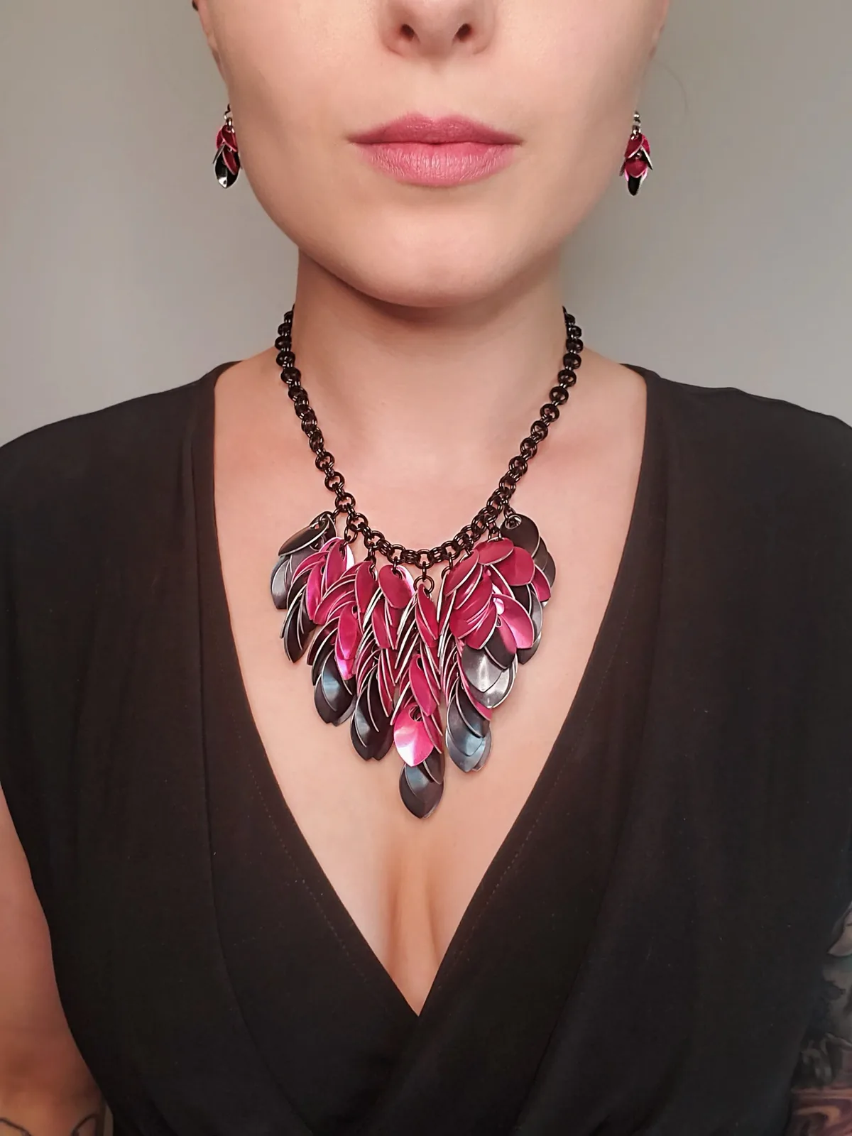 Elemental Leaves necklace with layered pink and dark metallic leaves