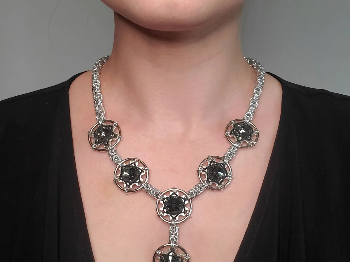 Close view of the Galaxy and Stardust necklace in a silver-tone finish