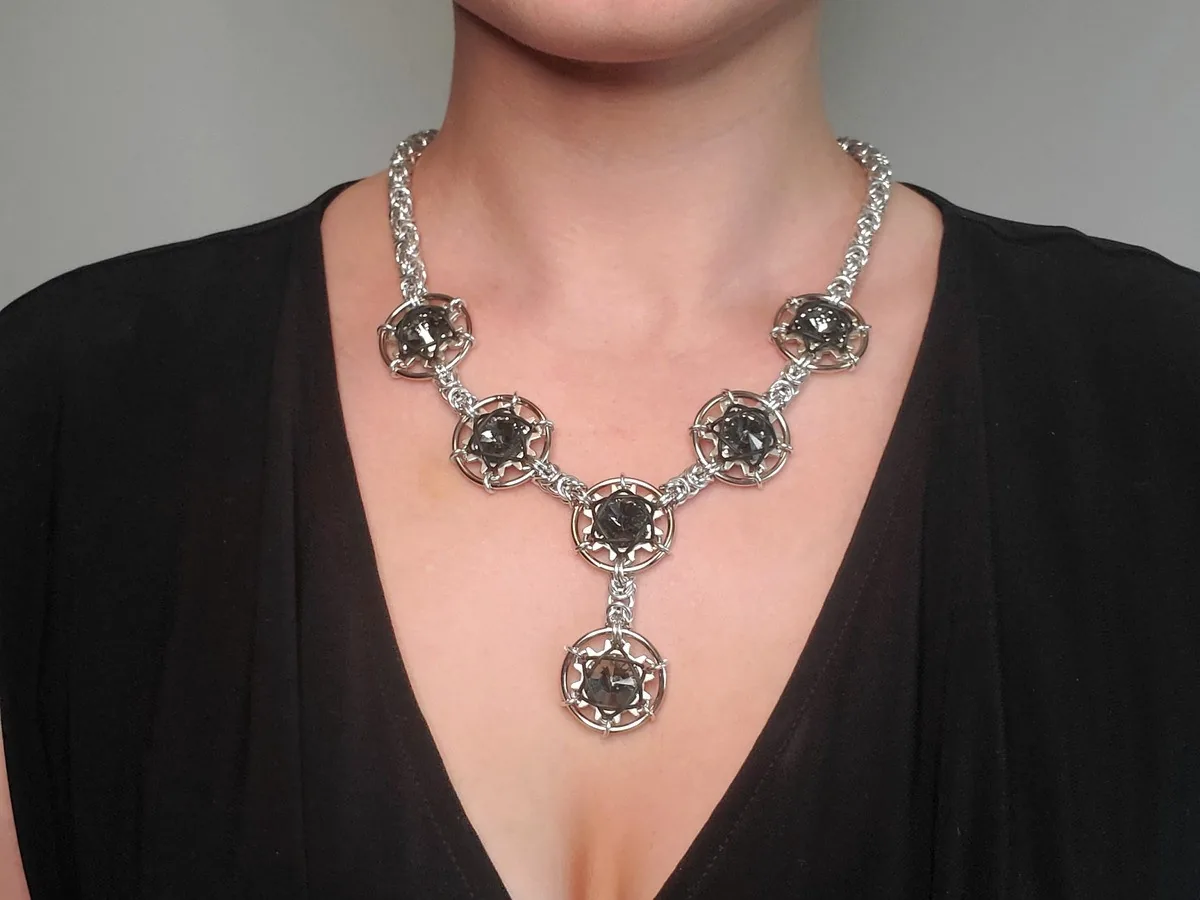 Galaxy and Stardust necklace in a silver-tone finish with dark faceted crystals