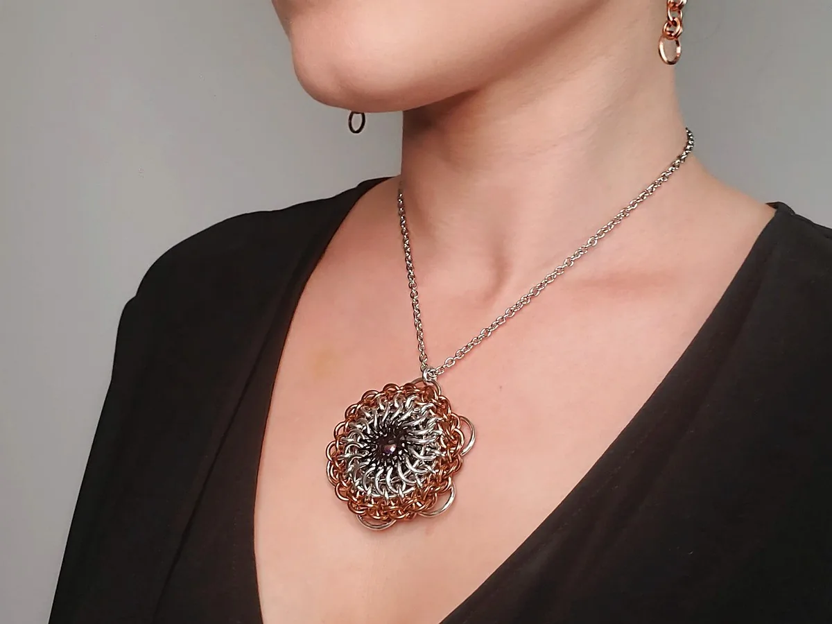 Eye of the Beholder pendant with a titanium ball at the center