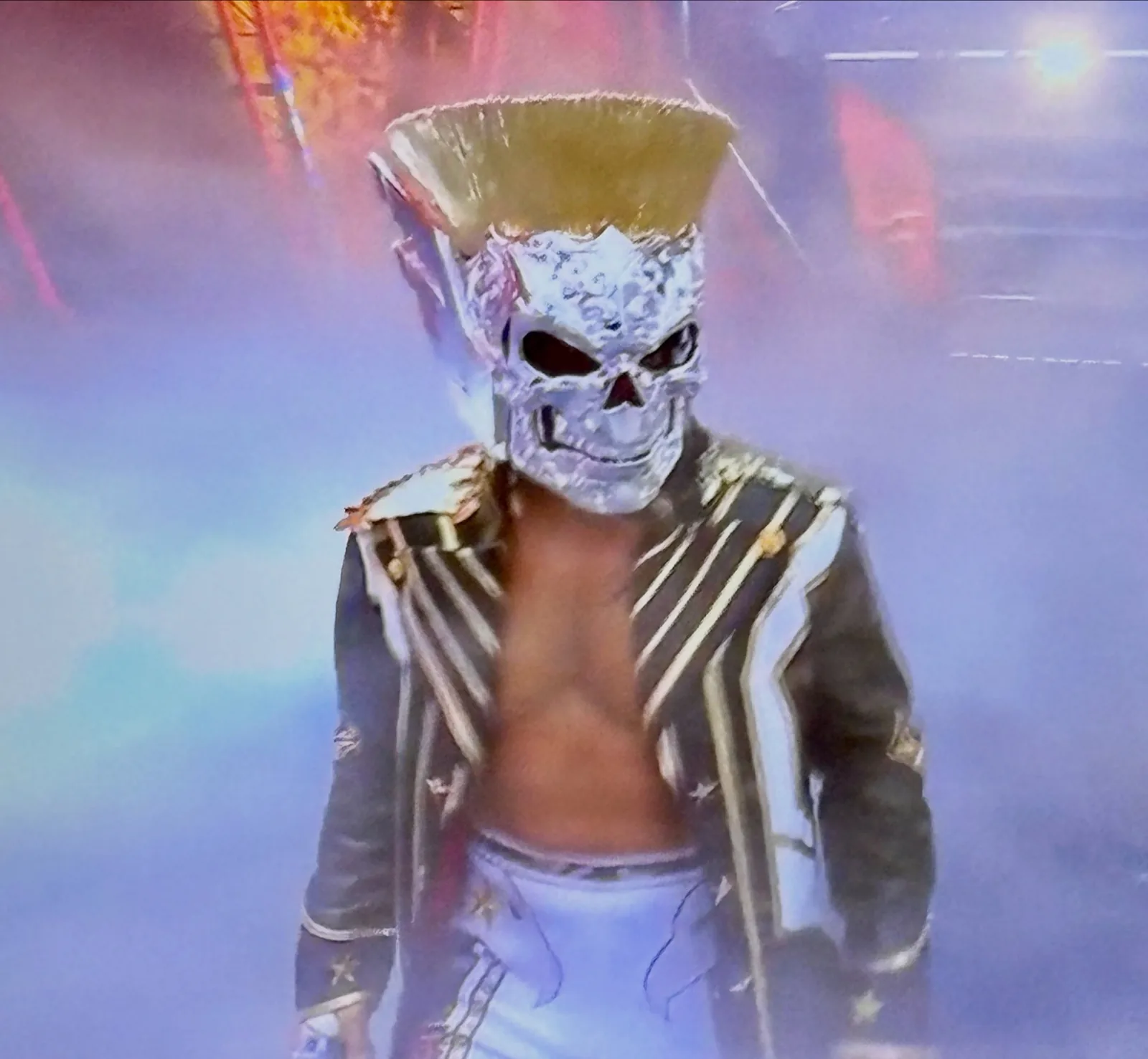 Front view of Cody Rhodes entrance coat showing scale shoulder detailing